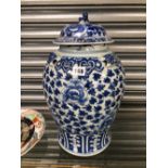 A CHINESE BLUE AND WHITE PORCELAIN JAR AND COVER PAINTED WITH SCROLLING LOTUS