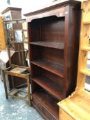 A HARD WOOD OPEN BOOKCASE