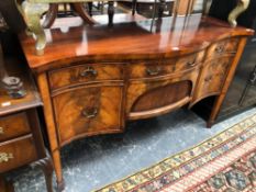 A ANTIQUE MAHOGANY SERPENTINE FRONT SIDEBOARD