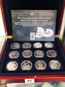 THE CROWN JEWELS SILVER PROOF COIN SET ADORNED WITH PRECIOUS STONES.