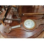 AN OAK CASED ANEROID BAROMETER TOGETHER WITH FOUR WALKING STICKS