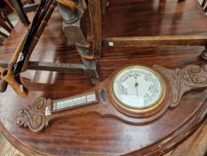AN OAK CASED ANEROID BAROMETER TOGETHER WITH FOUR WALKING STICKS