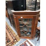 A GEORGIAN GLAZED CORNER CABINET.