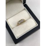 AN ANTIQUE OLD CUT DIAMOND THREE STONE RING, THE INSIDE SHANK ENGRAVED 48th ANNIVERSARY 1807-1855