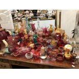 AN EXTENSIVE COLLECTION OF VICTORIAN AND LATER COLOURED GLASS VASES AND ORNAMENTS