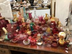 AN EXTENSIVE COLLECTION OF VICTORIAN AND LATER COLOURED GLASS VASES AND ORNAMENTS