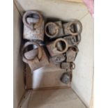 TWO GRADED SETS OF FIVE RING HANDLED IRON WEIGHTS, 14LBS TO 1LB