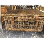 A LINEN BASKET CONTAINING BOOKS ON LOCAL VILLAGES, MEDICINE, WINE, ETC.