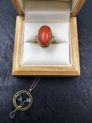 AN OVAL CORAL RING IN AN UNMARKED RUBOVER SET RING, ASSESSED AS 18ct GOLD, FINGER SIZE P, TOGETHER