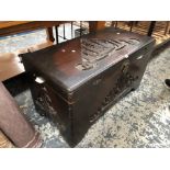 A VINTAGE CAMPHOR WOOD BLANKET CHEST CONTAINING VARIOUS LINENS AND TEXTILES.