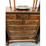 A KLING MAHOGANY CHEST, THE EIGHT DRAWERS BETWEEN FLUTED PILASTERS ON WAVY BRACKET FEET. W 102 x D