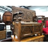 AN ANTIQUE GOOD QUALITY OAK MONKS BENCH.