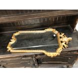 A GILT FRAMED WALL MIRROR