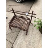 A WROUGHT IRON LARGE FIRE GRATE