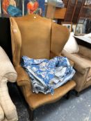A WING BACK ARMCHAIR