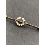 A PEARL AND SAPPHIRE BAR BROOCH. THE BROOCH STAMPED 15ct, ASSESSED AS 15ct GOLD, THE PIN 9ct GOLD.