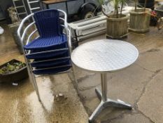 A BISTRO TABLE AND FOUR CHAIRS