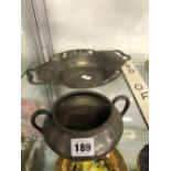 A TUDRIC PEWTER TWO HANDLED SHALLOW DISH TOGETHER WITH A TUDRIC PEWTER TWO HANDLED BOWL