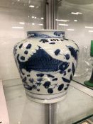 A MING STYLE BLUE AND WHITE JAR PAINTED WITH FISH AMONGST REEDS