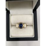 A 9ct HALLMARKED GOLD BLUE STONE CABOCHON SET RING SIGNED UZMAN. WEIGHT 6.26grms.
