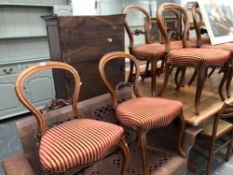 A SET OF EIGHT BALLOON BACK DINING CHAIRS