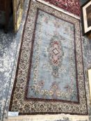 AN ORIENTAL RUG OF PERSIAN DESIGN. 230 x 140cms