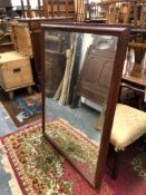 A LARGE PINE FRAMED MIRROR
