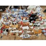 A COLLECTION OF ANTIQUE AND LATER COW CREAMERS