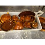 A COLLECTION OF BROWN GLAZED COOKING AND EATING WARES