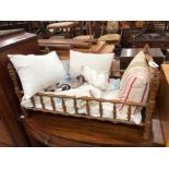 AN ANTIQUE FRENCH WOODEN DOLLS BED