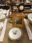 TWO TABLE CLOCKS, AN OIL LAMP AND SIX CROWN STAFFORDSHIRE PLATES