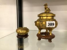 A ORIENTAL GILT BRONZE CENSOR TOGETHER WITH A SIMILAR LIDDED BOX EACH ON HARDWOOD STAND