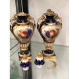 A PAIR OF ROYAL WORCESTER FRUIT DECORATED GILDED URNS STAMPED 1937.