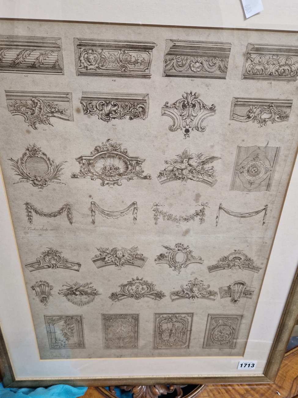 A GROUP OF FOUR VINTAGE FRENCH PRINTS OF ARCHITECTURE AND FURNITURE STYLES IN UNIFORM GILT FRAMES.