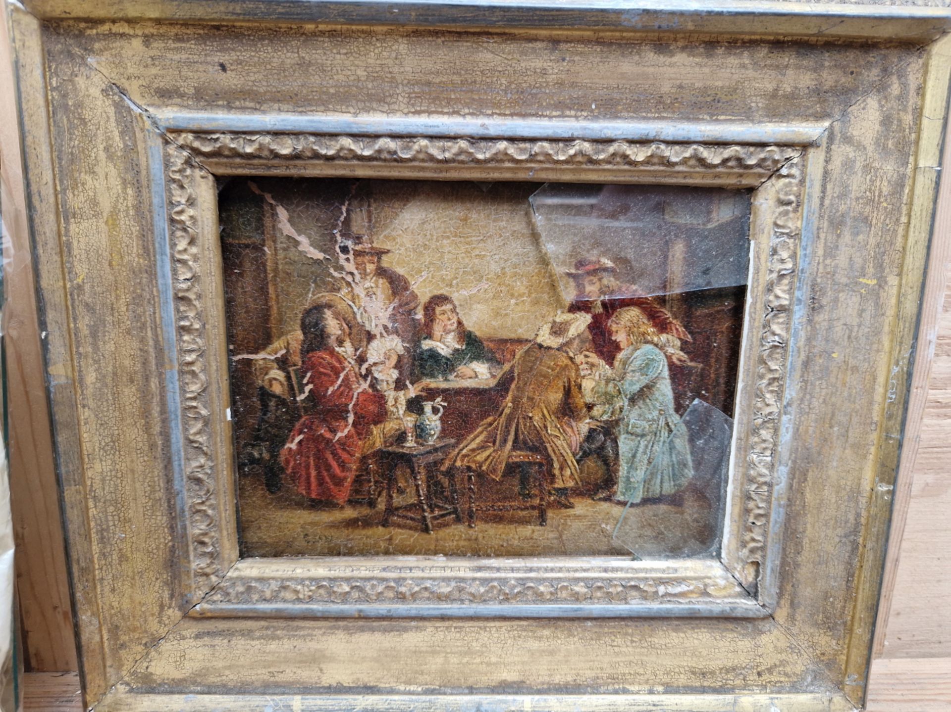 A PAIR OF GILT ROCOCO STYLE FRAMES TOGETHER WITH A GILT FRAMED PICTURE OF FIGURES IN A TAVERN. (3)