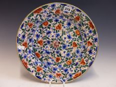 THE PORCELAIN CLAW, AN 18th C. DUTCH DELFT POLYCHROME DISH PAINTED WITH RED FLOWERS AND BLUE STARS
