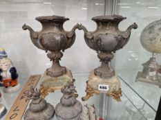A PAIR OF ROCOCO SPELTER TWO HANDLED URNS AND COVERS MOUNTED ON AGATE PLINTHS WITH GILT FEET
