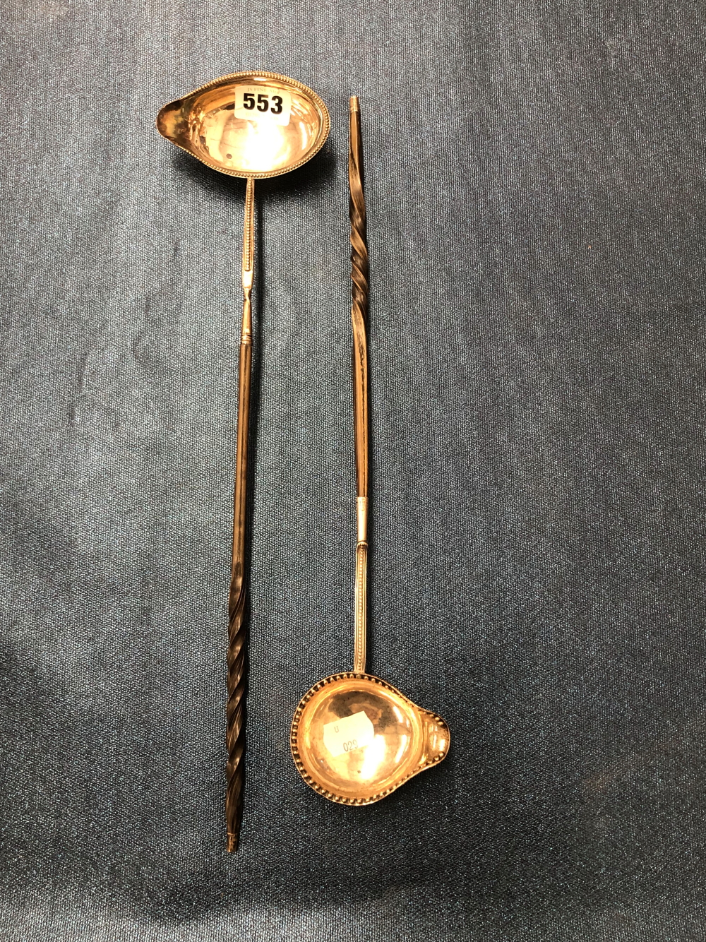 A PAIR OF SCOTTISH HORN HANDLED TODDY LADLES WITH WHITE METAL BOWLS