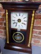 A LATE 19th C. WATERBURY CLOCK CO CLOCK STRIKING ON A COILED ROD, THE MOVEMENT IN A GLAZED