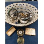 A FRENCH PORCELAIN BASKET OF DRESS JEWELLERY, LADYS WRISTWATCHES AND A CARTIER TRAVEL CLOCK