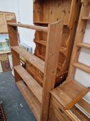 A PINE DRESSER AND PINE BOOKCASE.