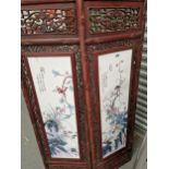 A PAIR OF CHINESE CERAMIC PANELS DECORATED WITH BIRDS AND FLOWERS WITHIN HARDWOOD FRAMES