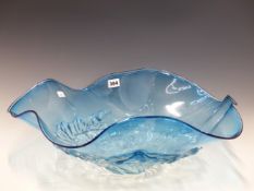 A STUDIO GLASS BOWL WITH A WAVY RIM ENCLOSING FLAMMIFORM BANDS IN RELIEF ABOUT THE FOOT. W 55cms.