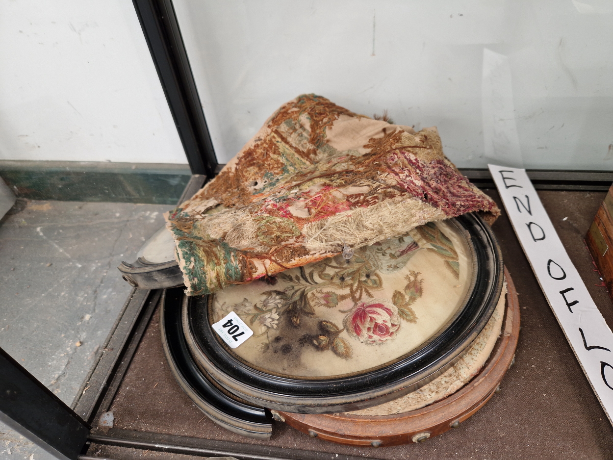 A NEEDLE WORKED FOOTSTOOL TOGETHER WITH A FRAMED AND AN UNFRAMED NEEDLEWORK