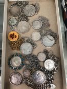 15 VARIOUS SILVER AND OTHER COINS IN PENDANT MOUNTS WITH CHAINS.