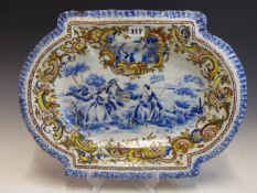 TWO POLYCHROME DELFT DISHES OF SIMILAR SHAPE, EACH PAINTED WITH CENTRAL SCENES OF 18th CENTURY