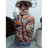 A JAPANESE IMARI VASE AS A LAMP WITH TERRACOTTA TEXTILE SHADE