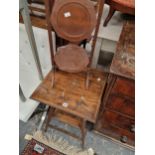 A FOLDING CAKE STAND AND A TWO TIER OCCASIONAL TABLE.