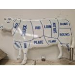 A BUTCHERS ENAMEL SIGN IN THE FORM OF A COW WITH THE CUTS NAMED IN BLUE ON A WHITE GROUND