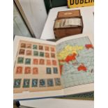 TWO STAMP ALBUMS OF EARLY TO MID 20th C. WORLD STAMPS, TOGETHER WITH CIGARETTE CARDS